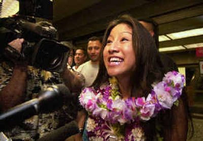 
Jasmine Trias talks to reporters after arriving at Honolulu International Airport in Honolulu. Trias advanced this week to the final three on Fox's 