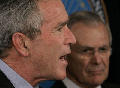 
President Bush makes a statement at the Pentagon on the war on terror, Thursday after attending a briefing there. Bush said that withdrawing U.S. forces from Iraq would make the world more dangerous.
 (Associated Press / The Spokesman-Review)