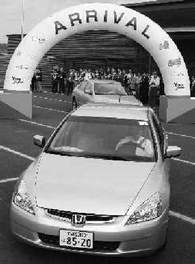 
Honda's hybrid Accord arrives at the Aichi Expo 2005 guesthouse from Kyoto at the end of an eco-car rally in June 2005.  
 (Associated Press / The Spokesman-Review)