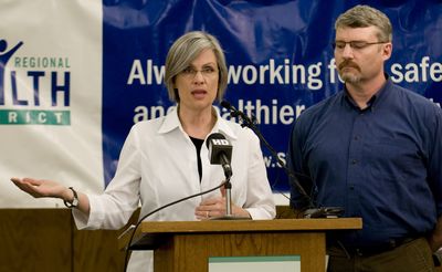 Spokane Regional  Health District spokeswoman Julie Graham and epidemiologist Bill Edstrom announce  probable cases of swine flu in Washington state, including one in Spokane man.   (Colin Mulvany / The Spokesman-Review)
