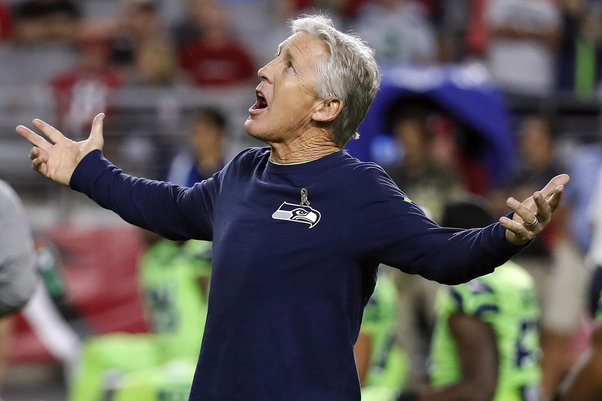 Seattle Seahawks head coach Pete Carroll looks at the open roof prior to Thursday night’s game against the Arizona Cardinals in Glendale, Ariz. (Rick Scuteri / Associated Press)