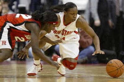 
Ohio State's Ashley Allen, right, and Rutgers' Matee Ajavon lunge for a loose ball. 
 (Associated Press / The Spokesman-Review)