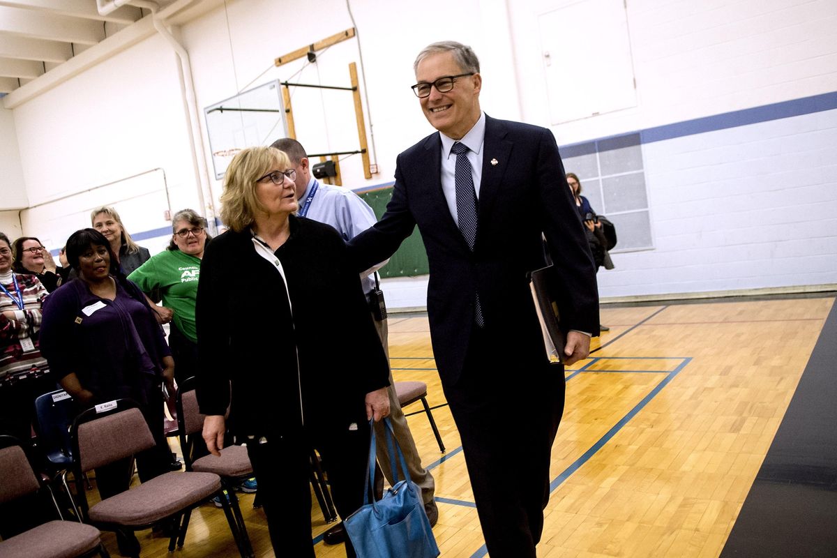 Gov. Jay Inslee and his wife, Trudi, walk to the front of the crowd at Eastern State Hospital in Medical Lake on Friday, March 10, 2017. He was there to praise the hospital for its progress on eliminating backlogs. (Kathy Plonka / The Spokesman-Review)