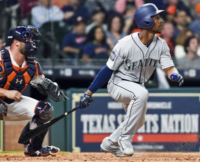 Seattle Mariners’ Jarrod Dyson watches his go-ahead RBI single in the ninth inning of the team's baseball game against the Houston Astros, Thursday, April 6, 2017, in Houston. (Eric Christian Smith / Associated Press)