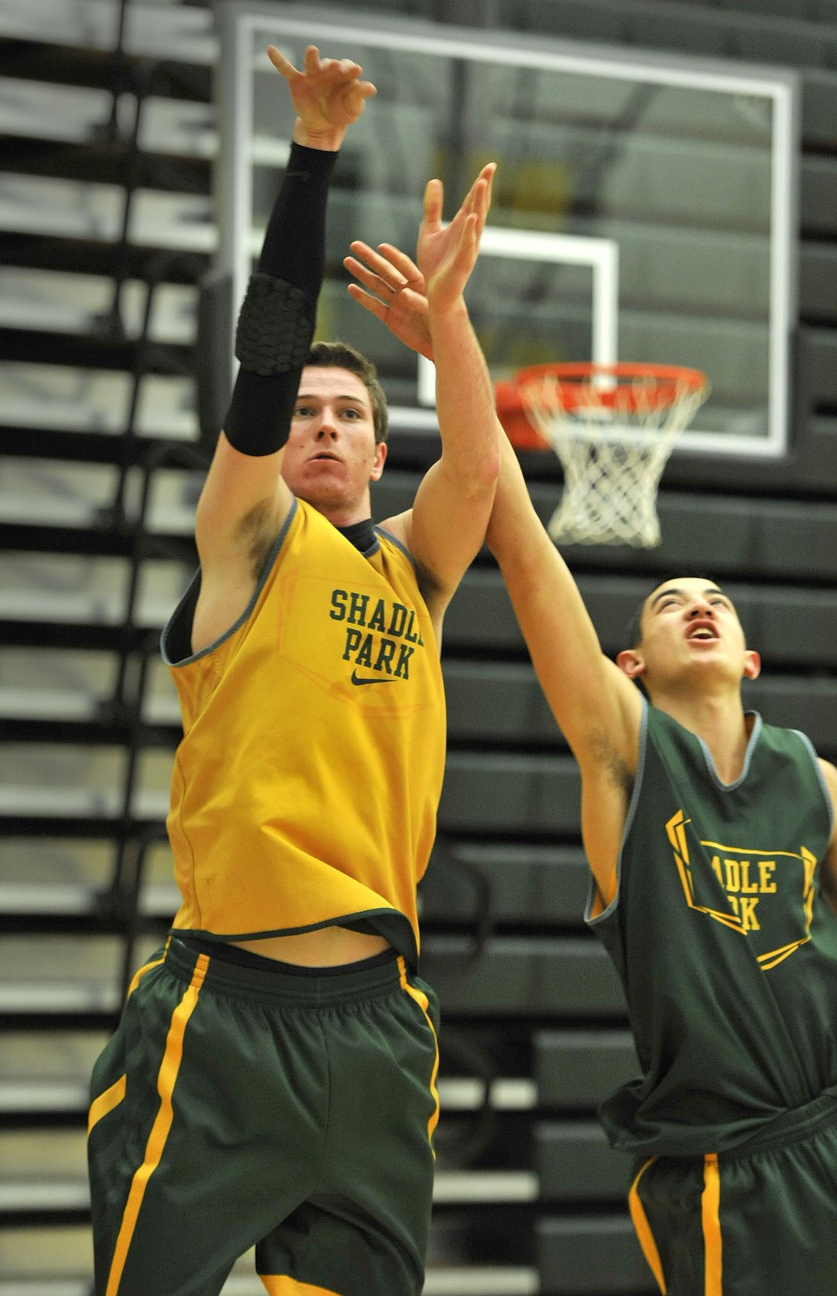 Shadle Park’s Brett Boese, shooting over George Pilimai during practice, is committed to WSU. (Dan Pelle)