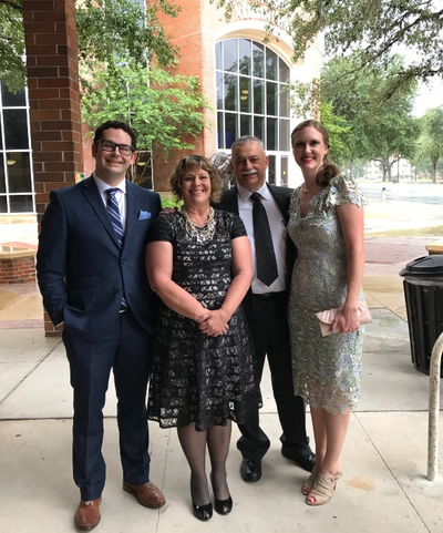 Dr. Seth Oliveria, left, and his wife, Stephanie,  far right, pose for a photo with Seth’s parents, Dave and Brenda Oliveria, prior to his graduation from the University of Florida Neurosurgery Department on June 17, 2017. (Courtesy Oliveria family)