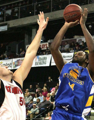 
Yakama Sun Kings' Ronny Turiaf shoots over the Idaho Stampede's Eric Chenowith during the first half Monday in Boise. Turiaf scored his first points on two free throws after being fouled by Chenowith, a 7-foot-1, 275-pound former University of Kansas standout. 
 (Associated Press / The Spokesman-Review)