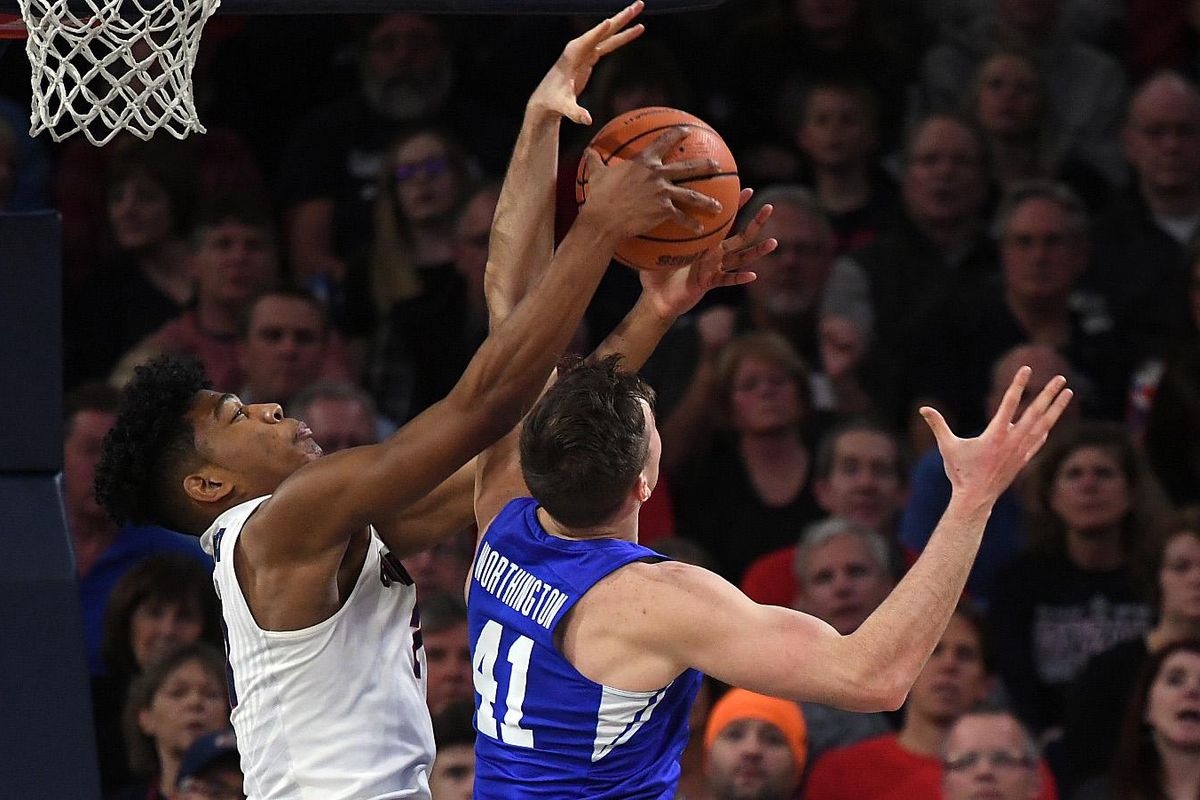 Gonzaga forward Rui Hachimura (21) and BYU forward Luke Worthington (41) compete for a rebound during a NCAA college basketball game, Sat., Feb. 3, 2018, in the McCarthey Athletic Center. (Colin Mulvany / The Spokesman-Review)