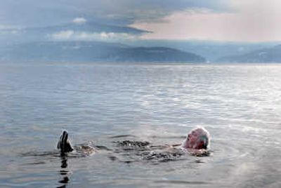 
Rick Klin, of Libby, Mont., relaxes in the chilly waters of Lake Coeur d'Alene on Tuesday after hundreds braved the cold weather in the annual Polar Bear Plunge. 
 (Brian Plonka / The Spokesman-Review)