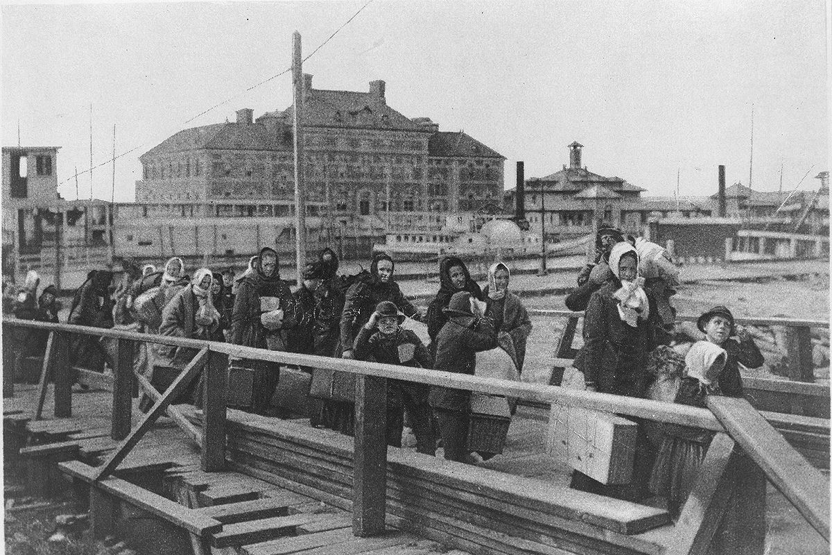 Immigrants arrive in 1902 at Ellis Island in New York.  (Library of Congress)