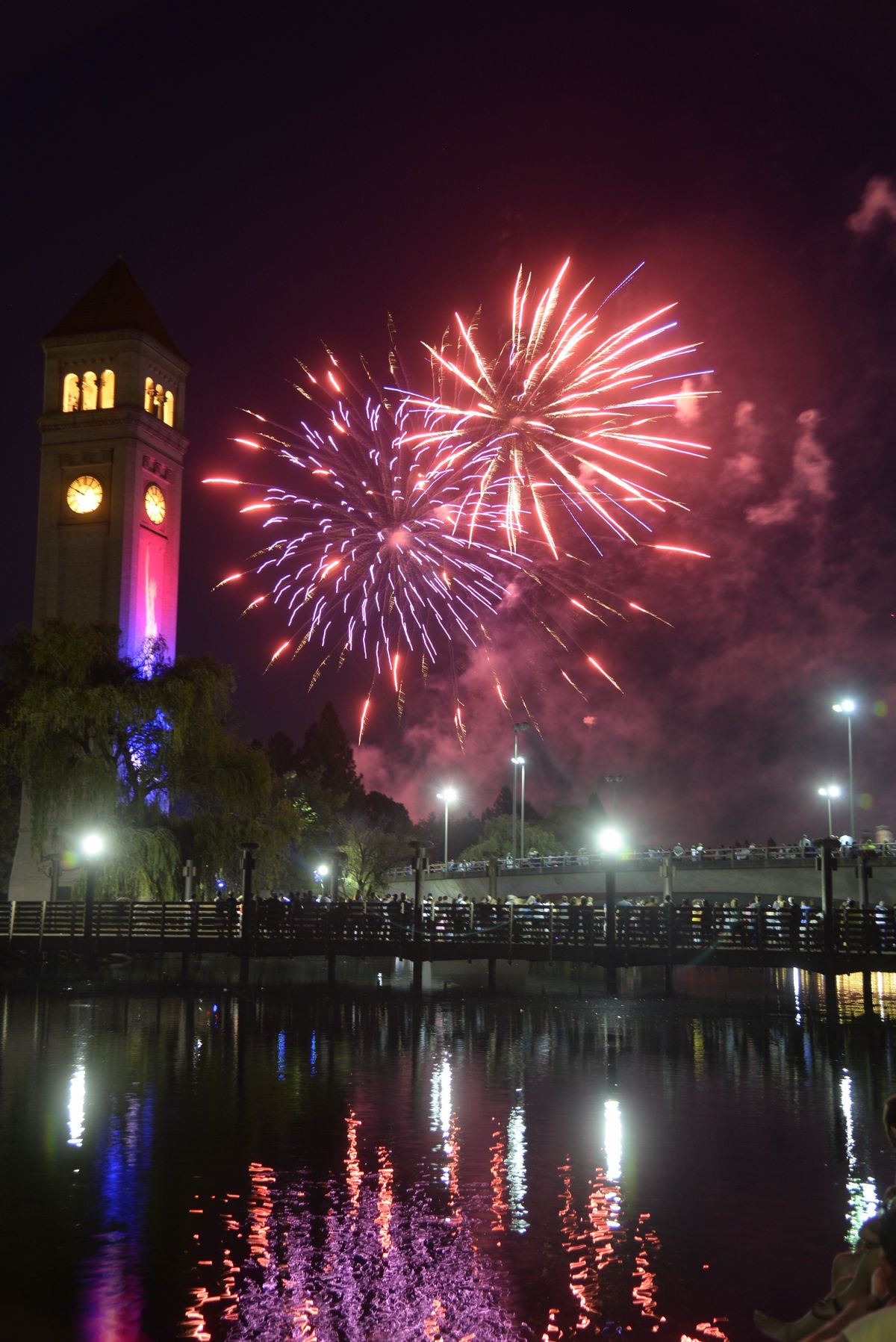 Fireworks explode Saturday over Riverfront Park as thousands watch the annual Fourth of July show in downtown Spokane. (Jesse Tinsley)