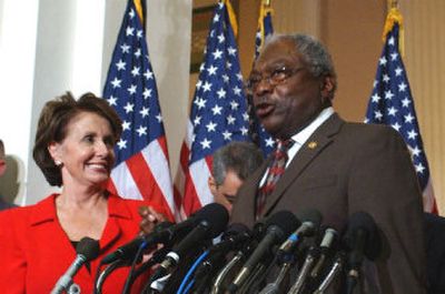 
Incoming House Speaker Nancy Pelosi of California looks on as incoming House Majority Whip James Clyburn of South Carolina speaks to reporters Thursday in Washington, D.C.
 (Associated Press / The Spokesman-Review)