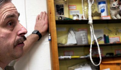 
Kootenai County Sheriff's Deputy D.J. Hall on Tuesday shows a display of  items confiscated from inmates at the Kootenai County Jail, including a noose of toilet paper. 
 (Kathy Plonka / The Spokesman-Review)