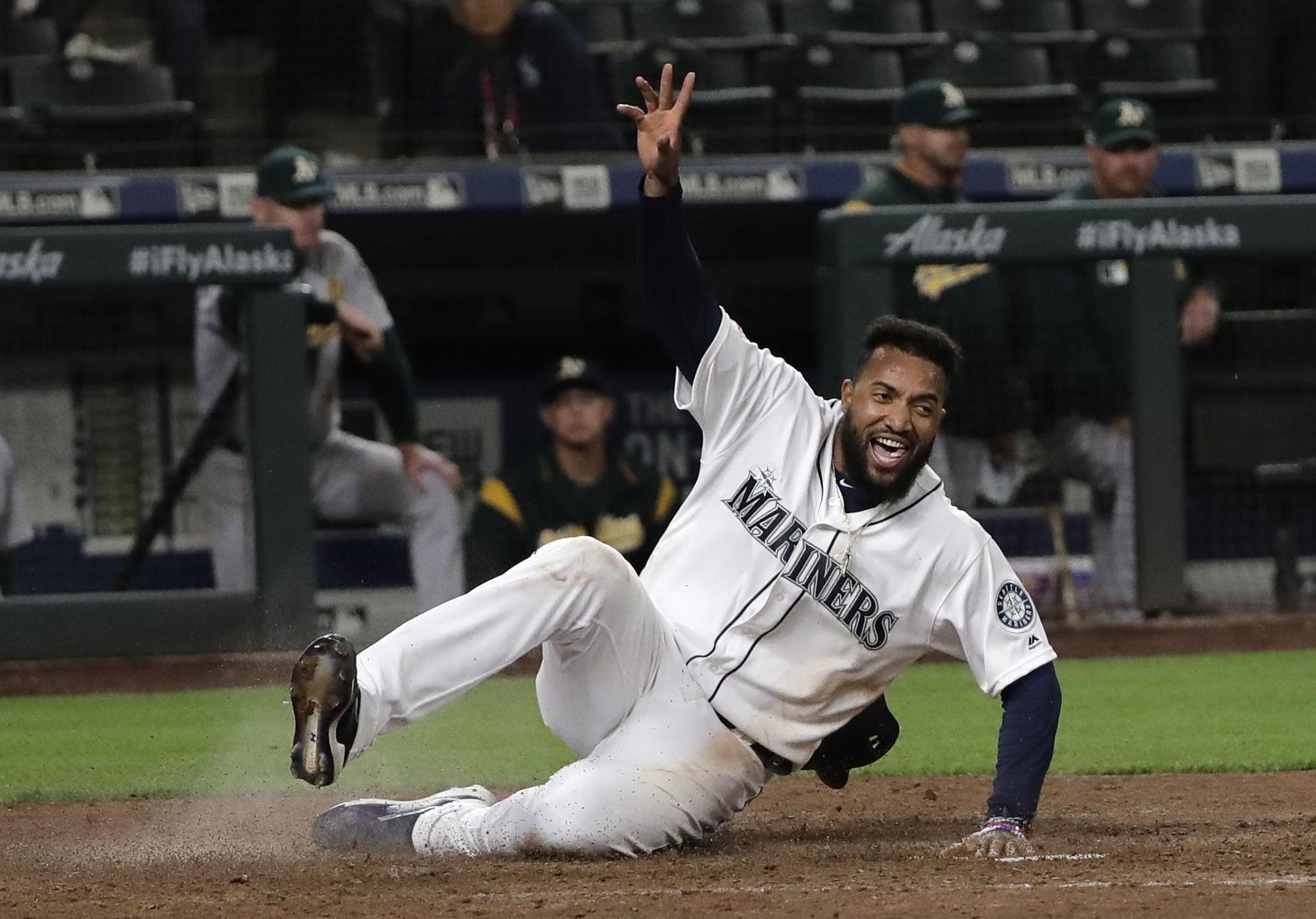 Mariners rally to defeat Oakland in extra innings, snap fourgame skid