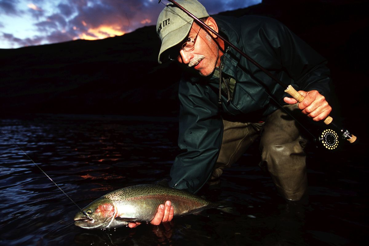 David Moershel of Spokane releases a steelhead during a fly fishing and rafting trip on the Grande Ronde in southeastern Washington. (Rich Landers / The Spokesman-Review)