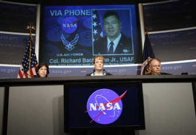 
NASA officials Ellen Ochoa, Shana Dale and Dr. Richard S. Williams, from left,  listen as Air Force Col. Richard E. Bachmann,  seen on screen, answers questions  regarding astronauts flying drunk. Associated Press
 (Associated Press / The Spokesman-Review)