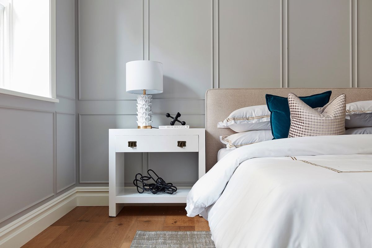 Wood paneling is used as an architectural element in a master bedroom. (Courtesy of Scott Gabriel Morris)