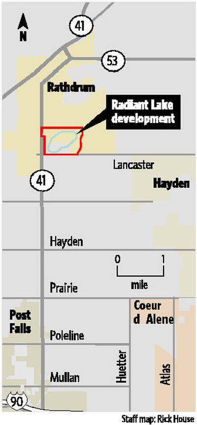 
Builder Dan Herby, left, and real estate agent Marcello Conigliaro, right, are marketing the first waterfront home on Radiant Lake, a man-made body of water south of Rathdrum.
 (Jesse Tinsley / The Spokesman-Review)