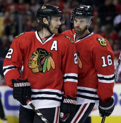 Chicago Blackhawks have already added defenseman Duncan Keith, left, here with left wing Andrew Ladd during a game Sunday against Washington. (Nam Y. Huh / Associated Press)