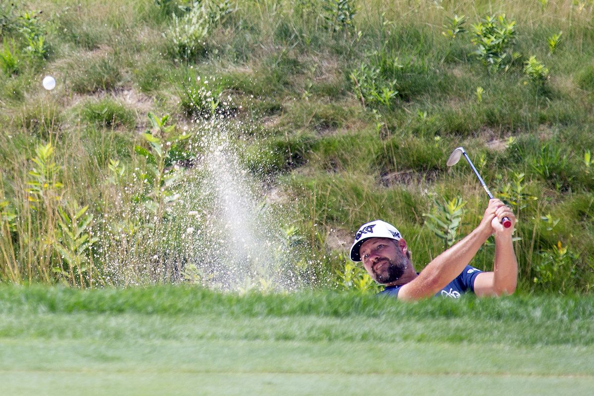 Ryan Moore hits out of a bunker on the 13th hole during the final round of the 3M Open golf tournament in Blaine, Minn., Sunday, July 26, 2020.  (Andy Clayton-King)