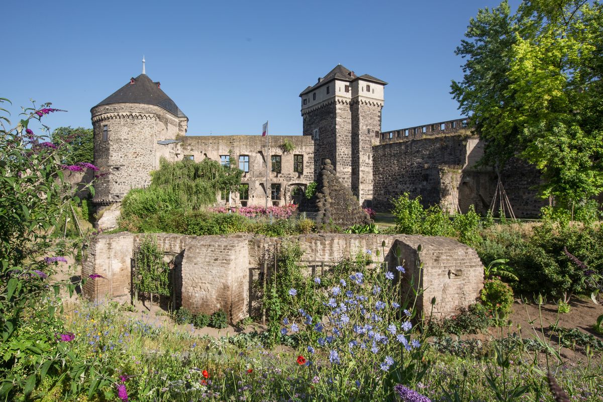 The grounds of this castle in Andernach, Germany, are filled with fruit trees, flowers and vegetable plants that anyone can pick.  (Andernach Tourism/Handout)