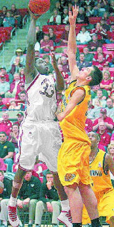 WSU's Ivory Clark shoots over California's Ryan Anderson.
(Associated Press / The Spokesman-Review)