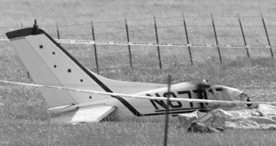 
Police tape marks the area around the tail section of a plane that crashed at Skydive Lost, west of Marion, Mont., killing all five people aboard Saturday. The pilot of the Cessna 182 operated by Skydive Lost Prairie was carrying two skydiving instructors and two trainees to jumps, said Michael Morrill, manager of the business. 
 (Associated Press / The Spokesman-Review)