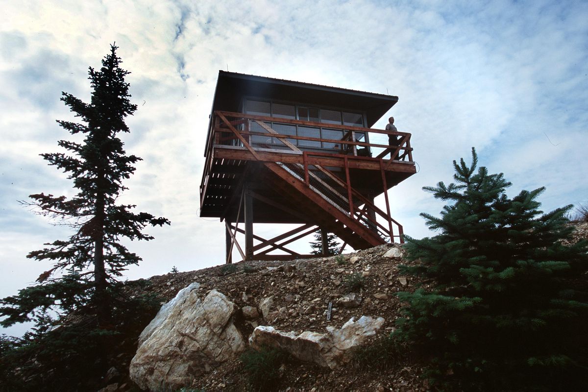 A fire lookout removed from the top of Mount Spokane in 2001 was restored and relocated on Quartz Mountain in Mount Spokane State Park where it debuted in 2005 as a popular rental for overnight use. Steve Christensen, Mount Spokane State Park manager, pictured here while installing the final touches on the lookout, had the vision to make it happen. (Rich Landers / The Spokesman-Review)