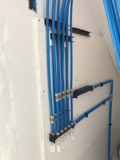 These are PEX cold water lines in my daughter’s new home. Each blue tube supplies cold water to a single fixture. (Tim Carter/Tribune Content Agency)