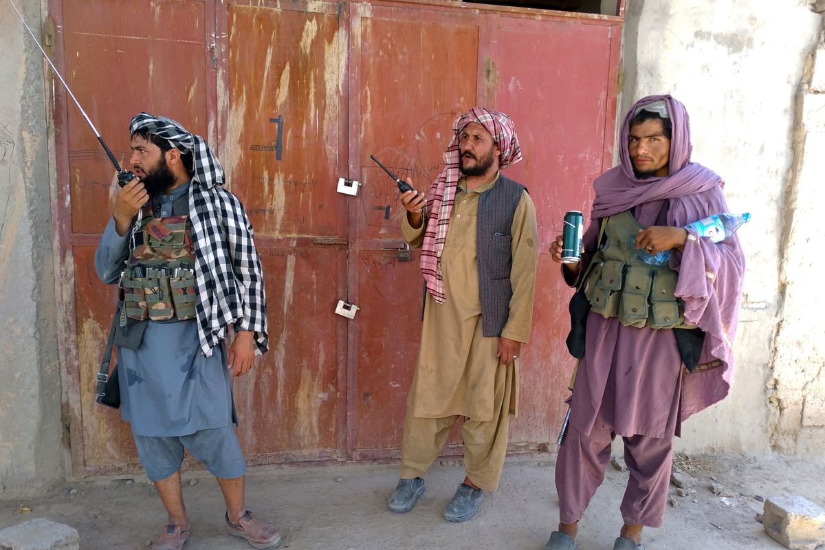 Taliban fighters stand guard at a checkpoint inside the city of Farah, capital of Farah province, southwest Afghanistan, Wednesday, Aug. 11, 2021. Afghan officials say three more provincial capitals have fallen to the Taliban, putting nine out of the country’s 34 in the insurgents’ hands amid the U.S. withdrawal. The officials told The Associated Press on Wednesday that the capitals of Badakhshan, Baghlan and Farah provinces all fell.  (Mohammad Asif Khan)