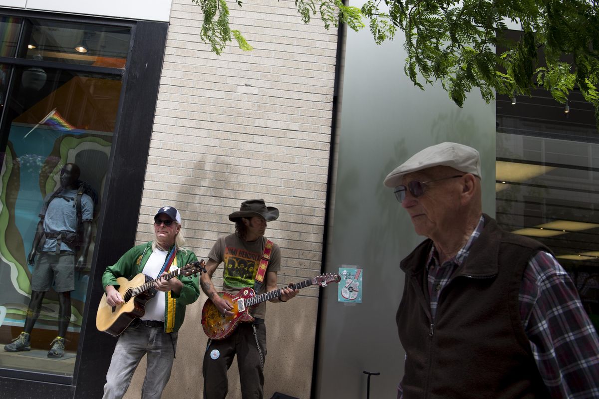Jim Lyons, left, and Jimmy Shore, of the band Flight Risk perform as Street Music Week kicks off on Monday, June 13, 2016, in downtown Spokane. (Tyler Tjomsland / The Spokesman-Review)