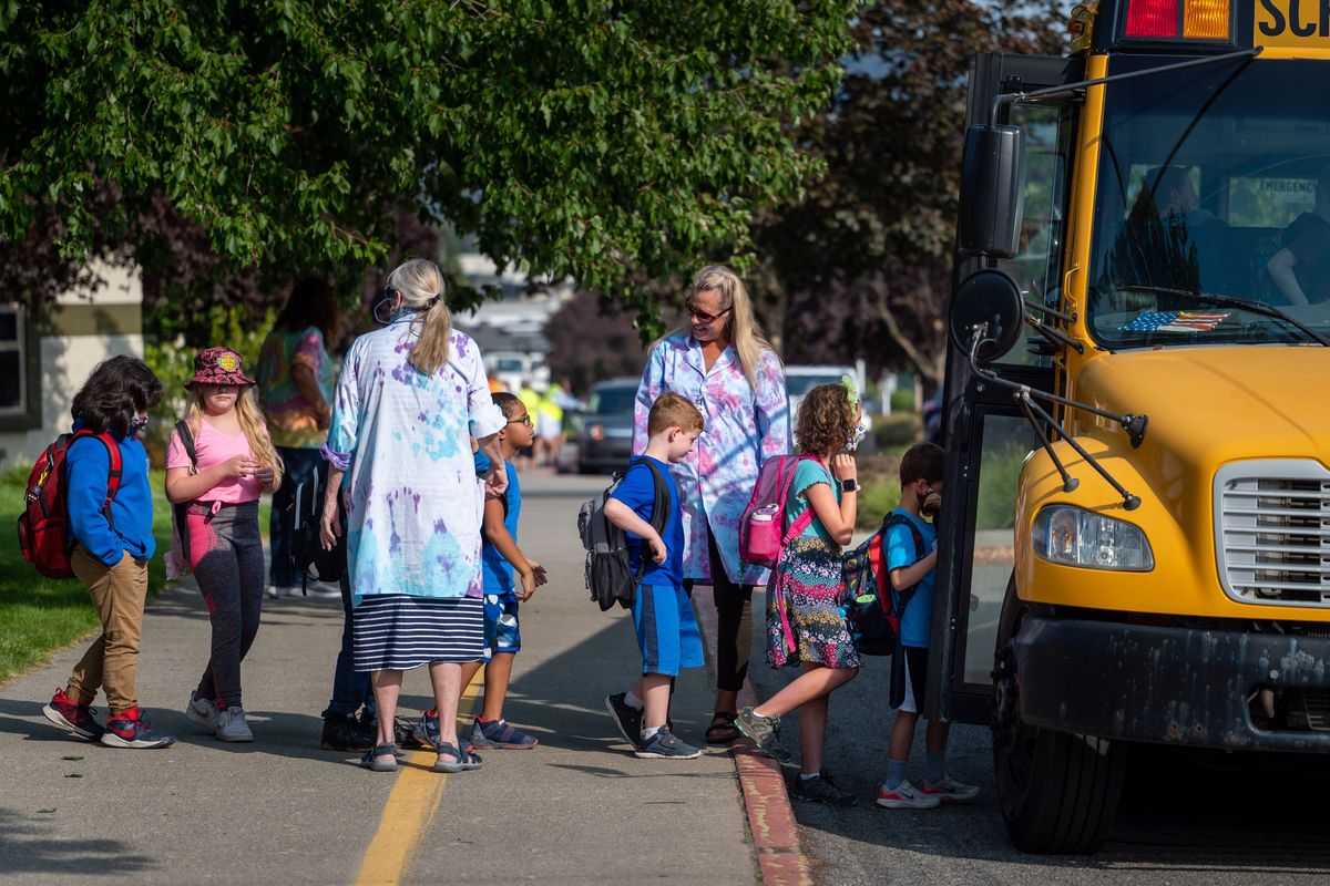 Ramsey Elementary students in Coeur d’Alene board their school bus after the first day of school, Tuesday, Sept. 7, 2021.  (COLIN MULVANY/THE SPOKESMAN-REVIEW)