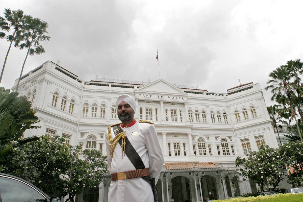 Raffles Hotel’s iconic sikh doorman stands in front of the hotel in Singapore in March 2007. (Wong Maye-E / Associated Press)