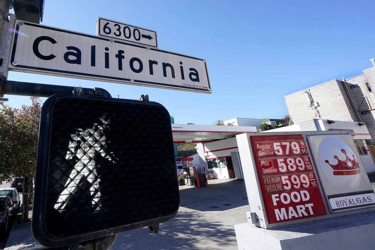 FILE - A California street sign is shown next to the price board at a gas station in San Francisco, on March 7, 2022. The average U.S. price of regular-grade gasoline shot up a whopping 79 cents over the past two weeks to $4.43 per gallon. Industry analyst Trilby Lundberg of the Lundberg Survey says Sunday, March 13, the new price exceeds by 32 cents the prior record high of $4.11 set in July 2008. Lundberg said gas prices are likely to remain high in the short term as crude oil costs soar amid global supply concerns following Russia