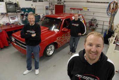 
Eddie Whipple, front, with his father Gordie, left, and brother, A.J., have built their S10 Blazer into a machine that competes in Las Vegas in the Street Car Super Nationals. 
 (Dan Pelle / The Spokesman-Review)