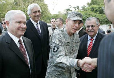 
Defense Secretary Robert Gates, left, and Iraqi President Jalal Talabani, right, stand with Army Gen. David Petraeus in Baghdad on Wednesday. Associated Press
 (Associated Press / The Spokesman-Review)