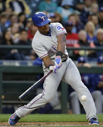Adrian Beltre starts Rangers off and running with RBI single in top of first inning Tuesday. (Elaine Thompson / Associated Press)