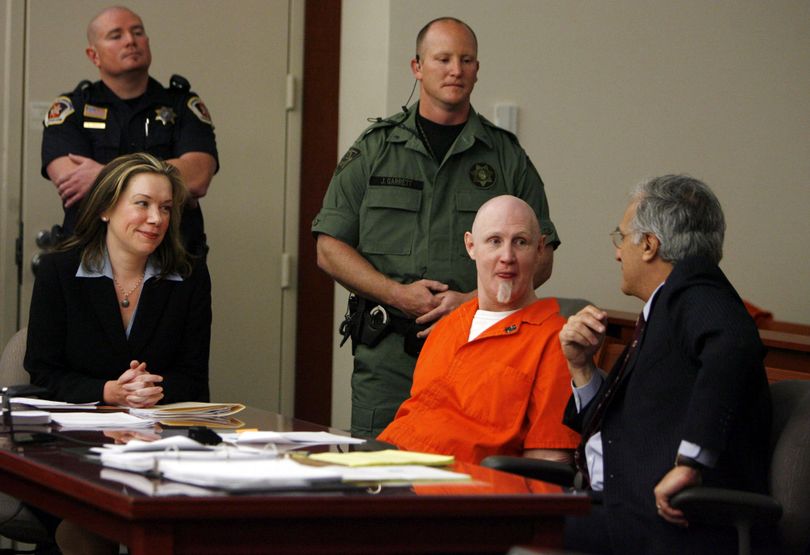 Convicted murderer Ronnie Gardner, center, sits with his defense team,  Andrew Parnes, right, and Megan Moriarty in Judge Robin Reese's courtroom at the Matheson Courthouse in Salt Lake City, Utah on  Friday, April 23,  2010. Judge Reese is being asked to issue a warrant setting an execution date for Gardner.  Under state law Gardner, 49, would be allowed to decide whether he would be killed by lethal injection or be shot by a five-man team of executioners firing from a set of matched rifles, a rarely used relic that harkens back to Utah's territorial history. (Francisco Kjolseth / The Salt Lake Tribune, Pool)