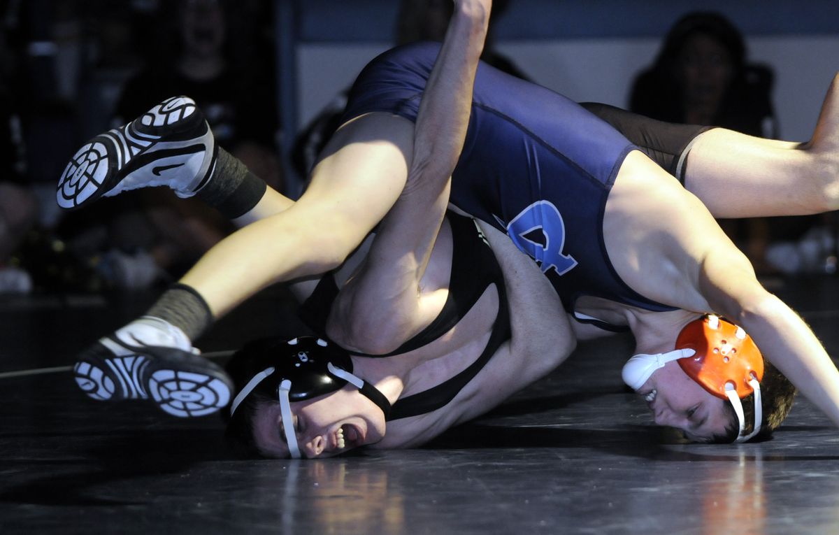 University’s Brandon Byers, left, isn’t too comfortable as he tangles with CV’s Braden Davis at 119 pounds. Byers won a 6-3 decision. (JESSE TINSLEY THE SPOKESMAN-REVIEW / The Spokesman-Review)