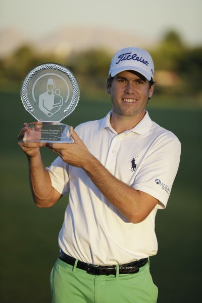 Ben Martin poses with his first PGA Tour trophy after winning in Las Vegas on Sunday. (Associated Press)