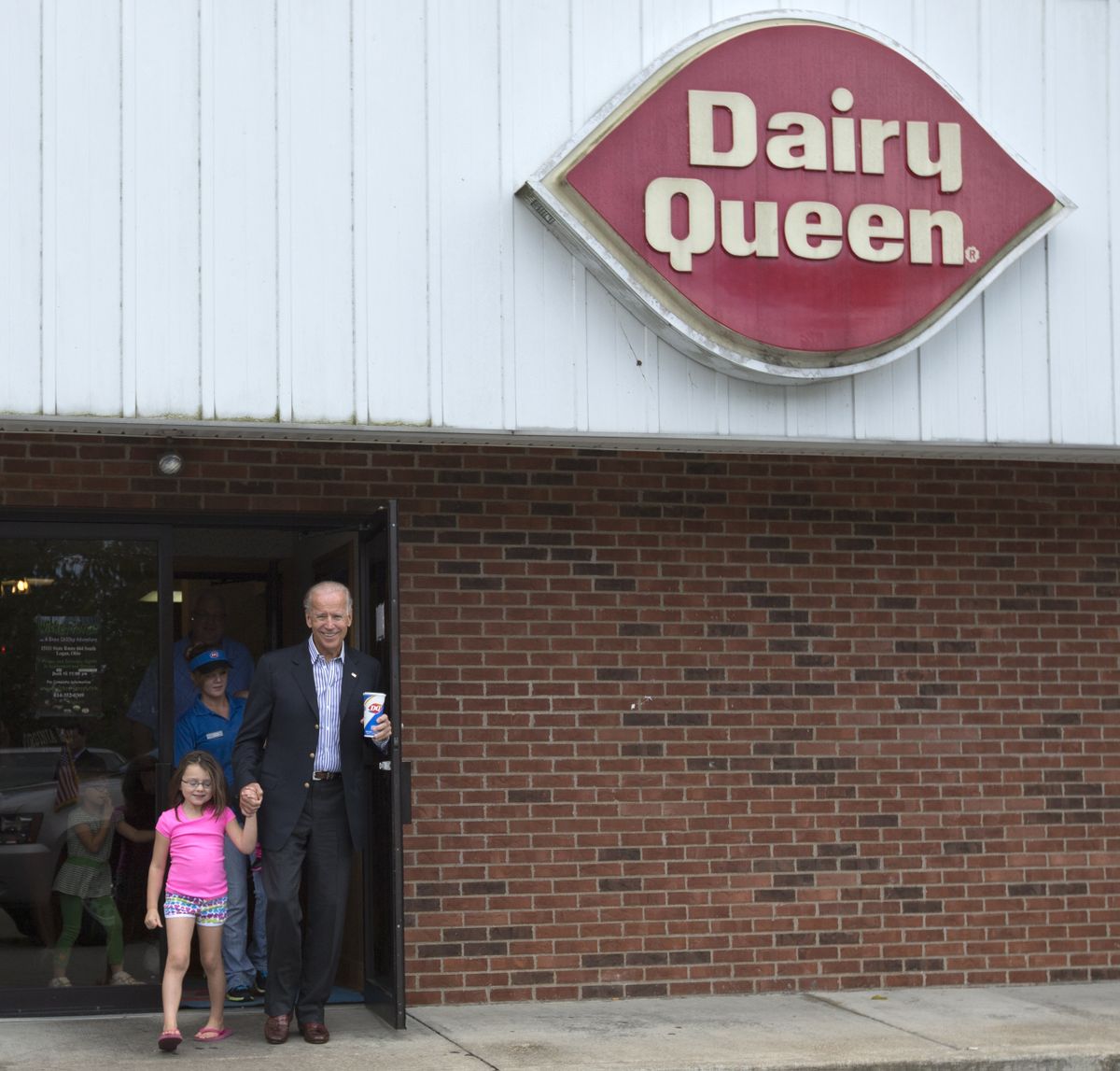 Vice President Joe Biden leaves Dairy Queen with an ice cream cone and holding the hands of a little girl, Saturday, Sept. 8, 2012, in Nelsonville, Ohio. (Carolyn Kaster / Associated Press)