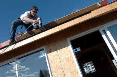 
The warm winter has allowed roofer Jim Ferriby, of Halfhide Kline Roofing, and others in the construction business to work with nearly no downtime this year. 
 (Jesse Tinsley/The Spokesman-Revi / The Spokesman-Review)