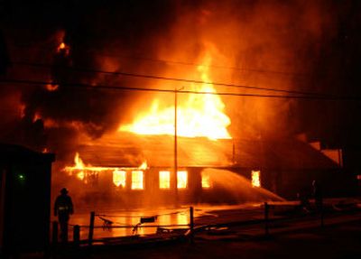 
Fire destroys the Warehouse Carpets Inc. building early Saturday morning.  
 (Mike Zambryski/Spokane Fire Department / The Spokesman-Review)