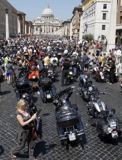 Harley-Davidson motorcycles are parked in Via della Conciliazione leading to St. Peter’s Square during a Mass celebrated by Pope Francis, at the Vatican on Sunday. (Associated Press)