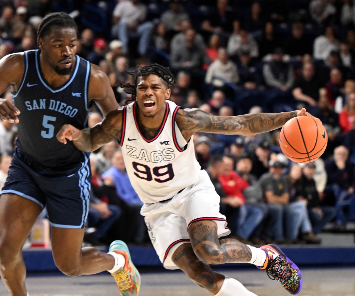 Gonzaga guard Khalif Battle dribbles as San Diego forward Bendji Pierre defends Wednesday night’s West Coast Conference game at McCarthey Athletic Center.  (COLIN MULVANY)