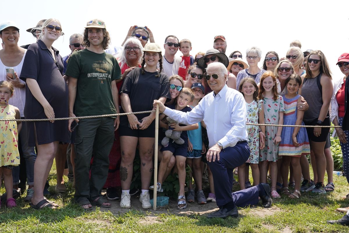President Joe Biden poses for a photo after touring King Orchards fruit farm Saturday, July 3, 2021, in Central Lake, Mich. (Alex Brandon)