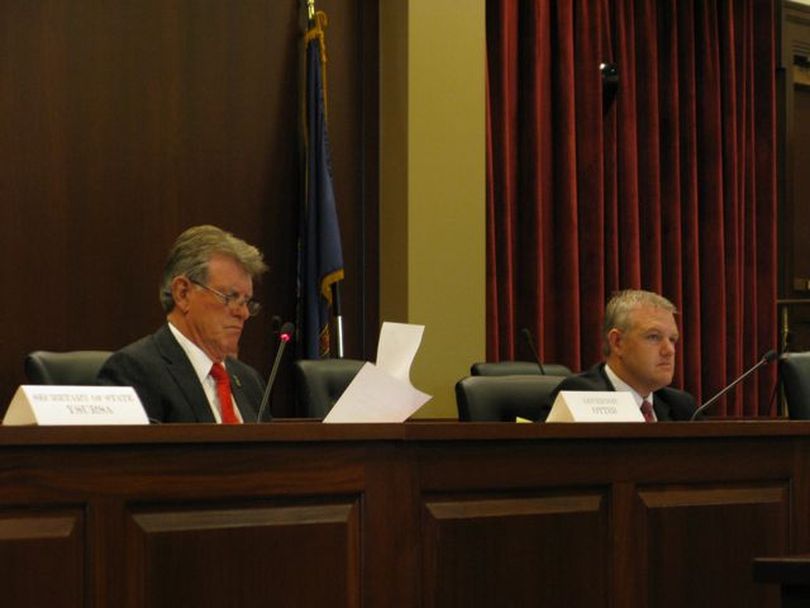 Members of Idaho's state Land Board, including Gov. Butch Otter, left, and acting state Controller Brandon Woolf, right, deliberate on Tuesday. (Betsy Russell)