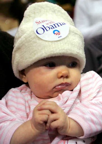 
Three-month-old Maria McDermott wears an Obama sticker Thursday during a Dubuque, Iowa, caucus. Associated Press
 (Associated Press / The Spokesman-Review)