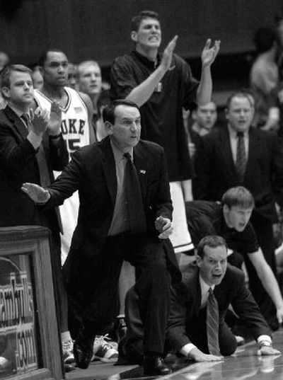 
Duke's head coach Mike Krzyzewski slaps the scorers table in the remaining minutes of the game.
 (Associated Press / The Spokesman-Review)