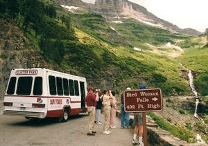 
Sun Tours customers stop on Going-to-the-Sun Road to view Bird Woman Falls in Glacier National Park, Mont. 
 (Associated Press / The Spokesman-Review)